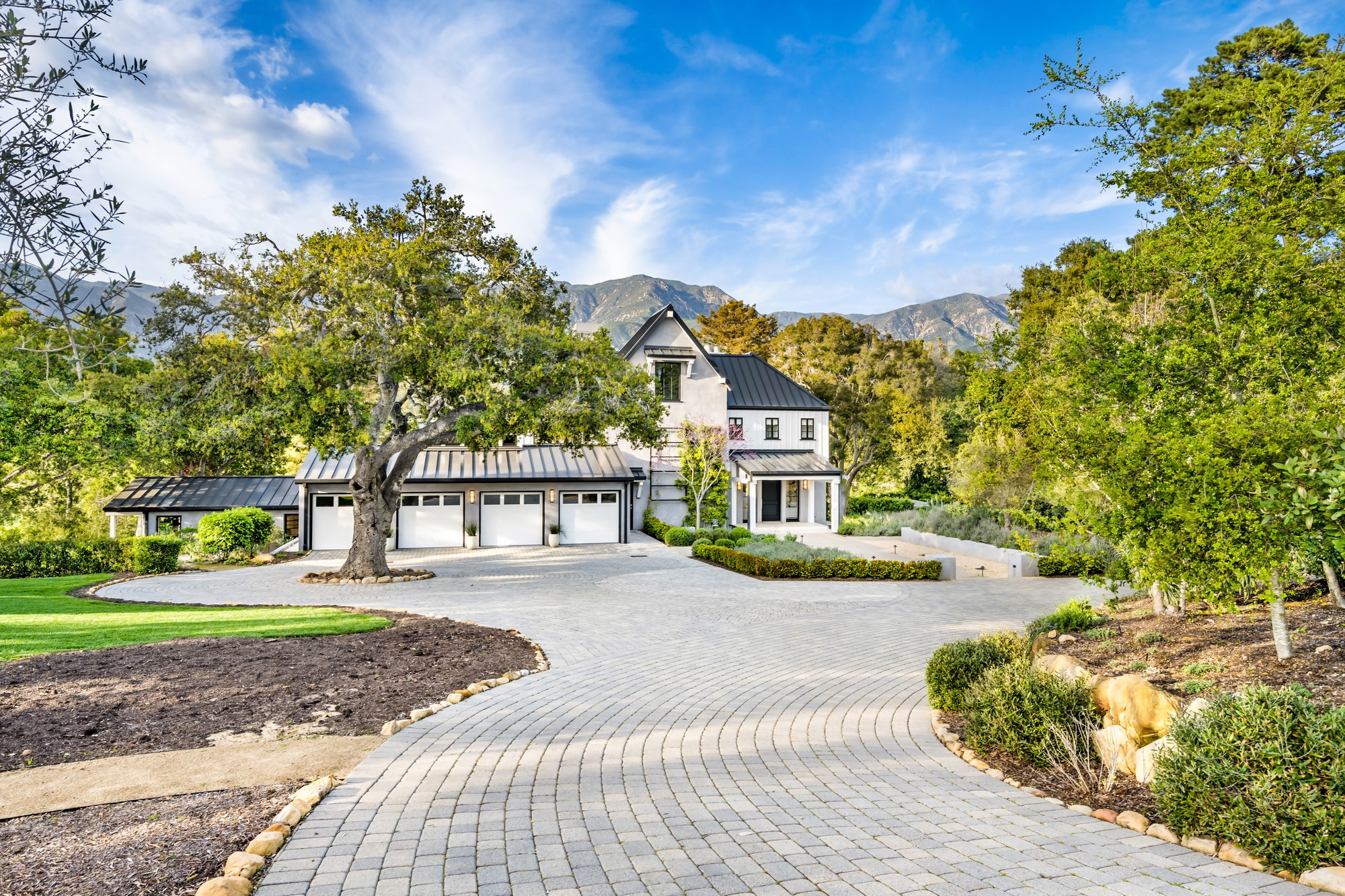 this home has brick driveways and driveways in front of it